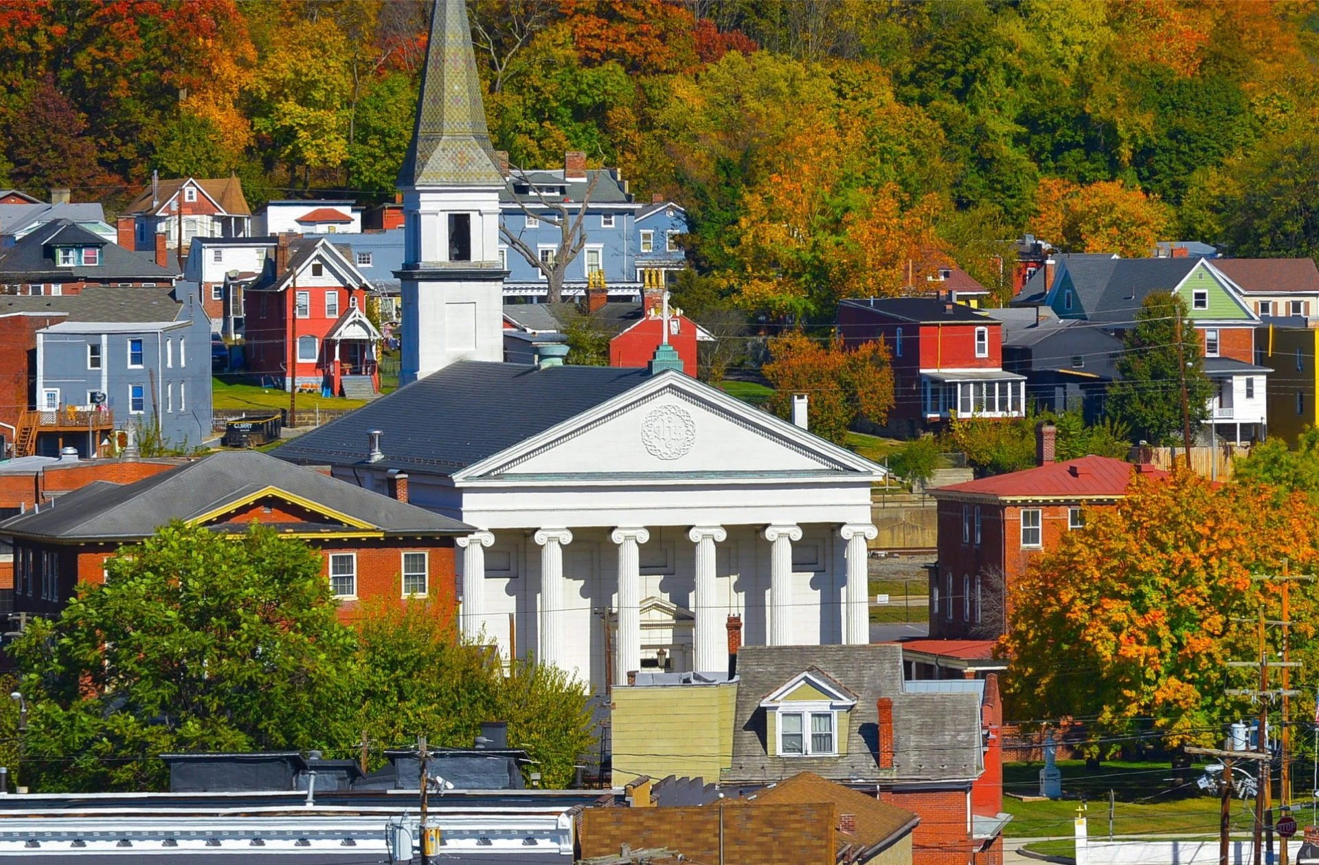 Historic church and colorful houses in autumn.